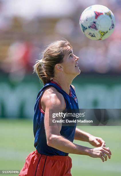 Brandi Chastain of the USA warms up by juggling the ball with her head before a semi-final match against Brazil during the 1999 Women's World Cup...