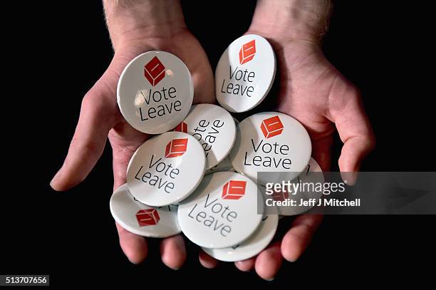 Man holds vote leave EU badges at the Scottish Conservative Party spring conference on March 4, 2016 in Edinburgh, Scotland. Prime Minister David...