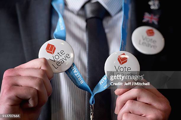 Man holds vote leave EU badges at the Scottish Conservative Party spring conference on March 4, 2016 in Edinburgh, Scotland. Prime Minister David...