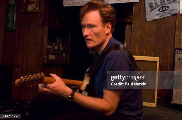 American comedian and television host Conan O'Brien plays the guitar at the BLUES nightclub, Chicago, Illinois, April 19, 2006.