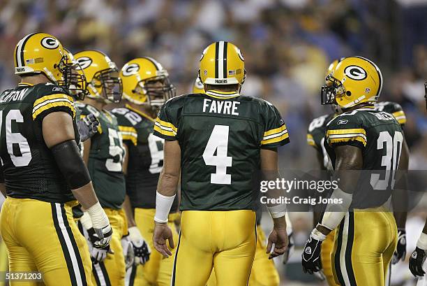 Quarterback Brett Favre of the Green Bay Packers huddles with his teammates during the game against the Carolina Panthers at Bank of America Stadium...