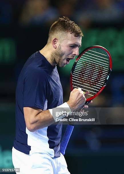 Daniel Evans of Great Britain celebrates a point in his singles match against Kei Nishikori of Japan during day one of the Davis Cup World Group...