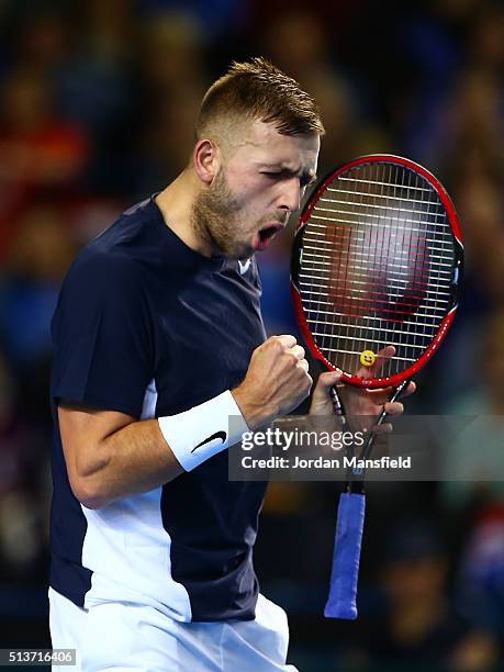 Daniel Evans of Great Britain celebrates as he levels it at 5-5 in the second set during the singles match against Kei Nishikori of Japan on day one...