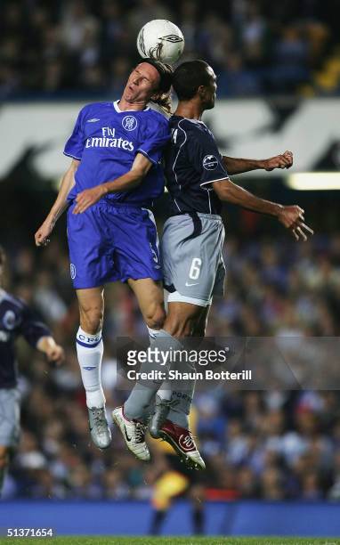 Alexei Smertin of Chelsea jumps for the ball with Costinha of FC Porto during the UEFA Champions League Group H match between Chelsea and FC Porto at...