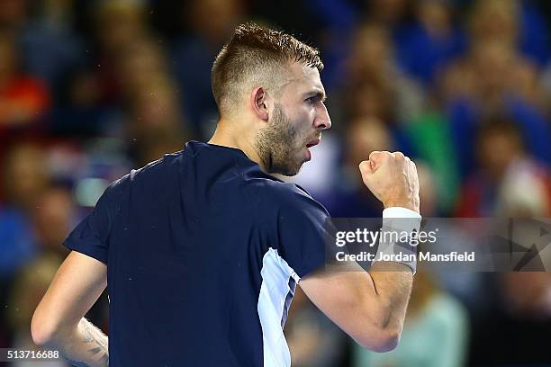 Daniel Evans of Great Britain celebrates as he levels it at 5-5 in the second set during the singles match against Kei Nishikori of Japan on day one...