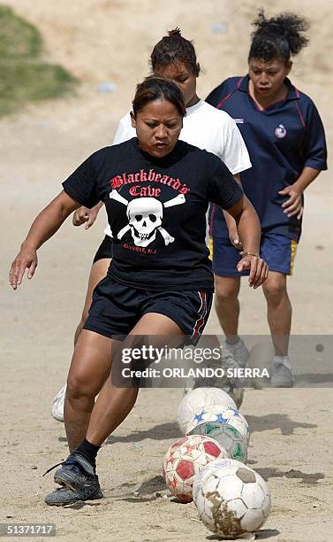 Members of the female soccer team "Estrellas de la Linea", which is constituted by prostitutes, train in Guatemala City, 29 September 2004. The team,...