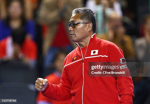 Japan captain Minoru Ueda celebrates during the singles match between Kei Nishikori of Japan and Daniel Evans of Great Britain on day one of the...