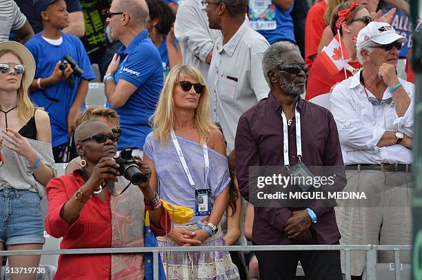 Isabelle Camus, the companion of France's Davis cup head coach and team captain Yannick Noah and Noah's father Zacharie Noah attend the match...