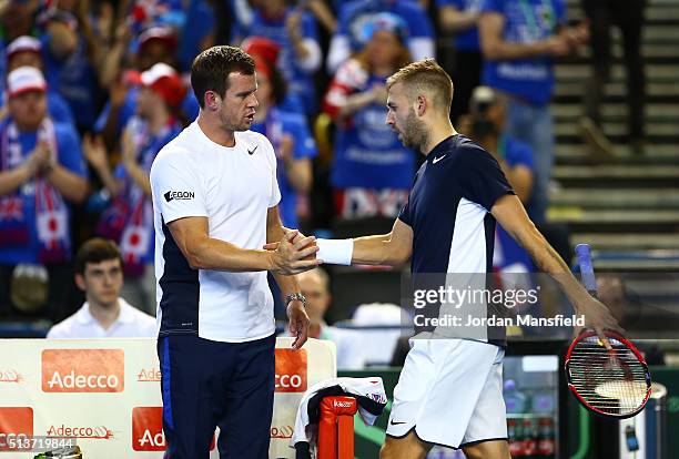Daniel Evans of Great Britain receives words of encouragement fom Leon Smith the Great Britain team captain during the singles match against Kei...