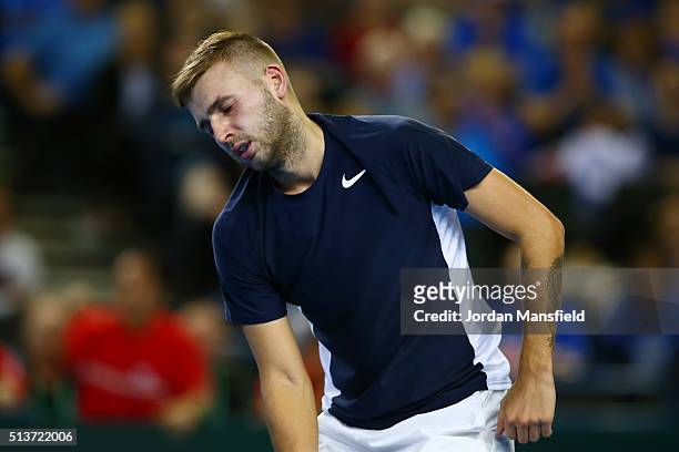 Daniel Evans of Great Britain reacts during the singles match against Kei Nishikori of Japan on day one of the Davis Cup World Group first round tie...