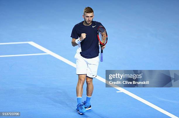 Daniel Evans of Great Britain celebrates a point in his singles match against Kei Nishikori of Japan during day one of the Davis Cup World Group...