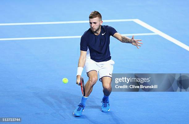 Daniel Evans of Great Britain volleys in his singles match against Kei Nishikori of Japan during day one of the Davis Cup World Group first round tie...