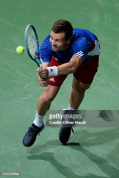 Tomas Berdych of Czech Republic plays his backhand in his match against Alexander Zverev of Germany during Day 1 of the Davis Cup World Group first...