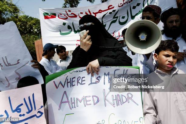 During a speech by a Canadian Arab, Maulana Ghazi Abdul Rashid , watches the crowd on August 13 Islamabad, Pakistan, the nation's capital. The cleric...