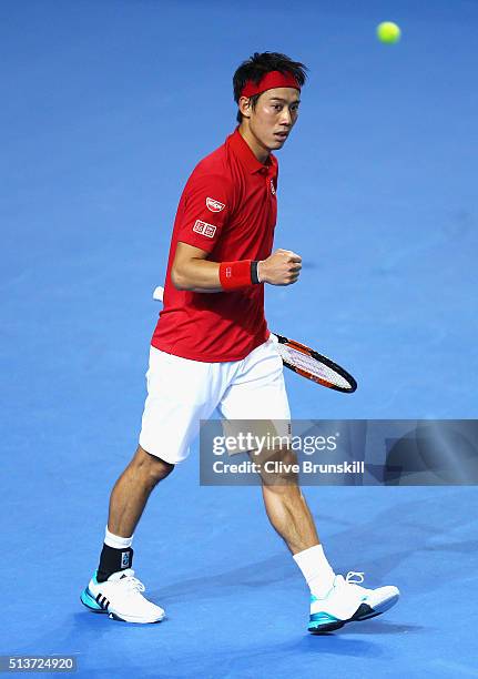 Kei Nishikori of Japan celebrates victory in his singles match against Daniel Evans of Great Britain during day one of the Davis Cup World Group...