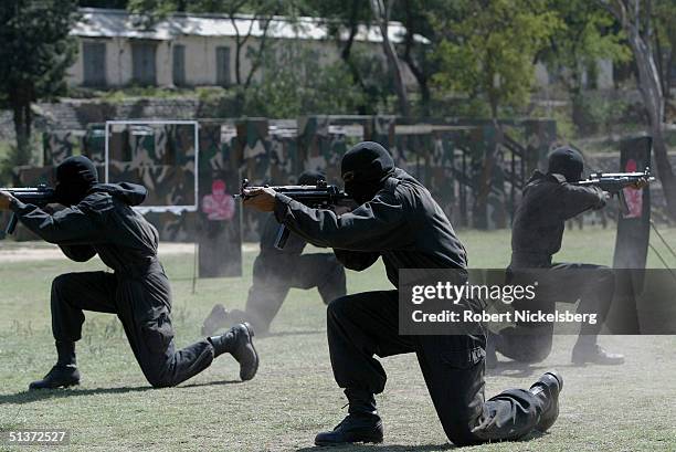 Members of Pakistan's elite Special Services Group , go through an urban warfare drill, at the main training center in Cherat, Pakistan on August 28...