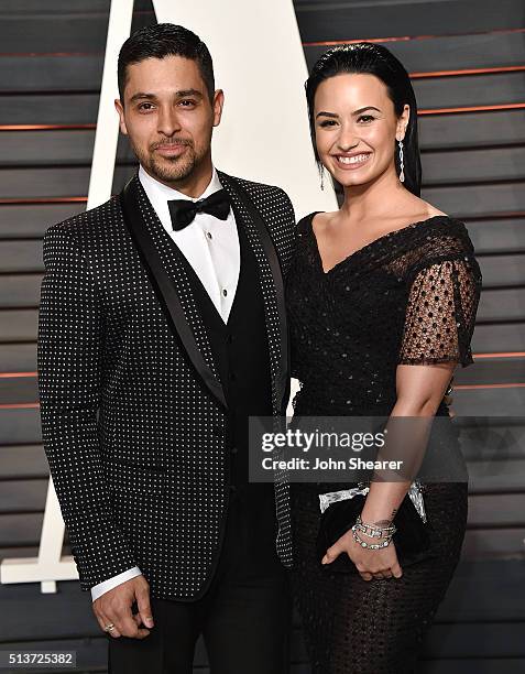 Actor Wilmer Valderrama and singer Demi Lovato arrives at the 2016 Vanity Fair Oscar Party Hosted By Graydon Carter at Wallis Annenberg Center for...