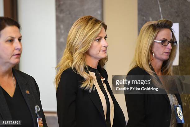 Sportscaster and television personality Erin Andrews, center, arrives in court on March 4, 2016 in Nashville, Tennessee. Andrews is taking legal...
