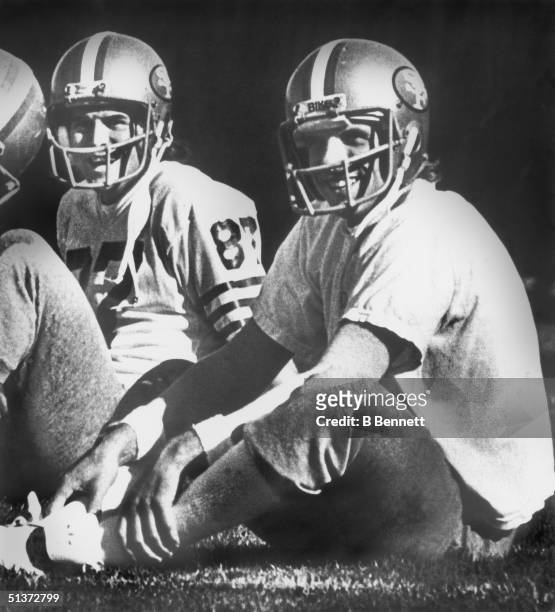Wide receiver Dwight Clark and quarterback Joe Montana of the San Francisco 49ers take a breather during practice for Super Bowl XVI in Redwood City,...
