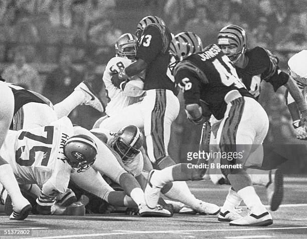 Quarterback Ken Anderson of the Cincinnati Bengals hands off to teammate Pete Johnson against the San Francisco 49ers on Super Bowl XVI at the...