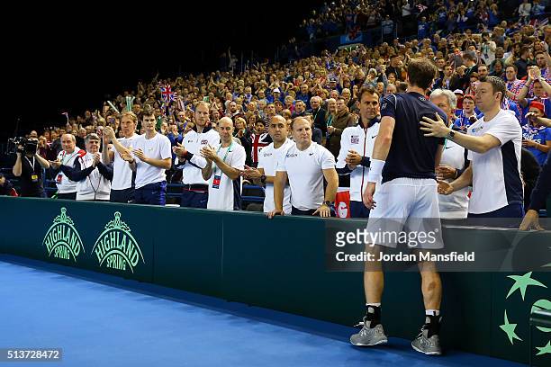 Andy Murray of Great Britain celebrates victory with his teamates after the singles match against Taro Daniel of Japan on day one of the Davis Cup...