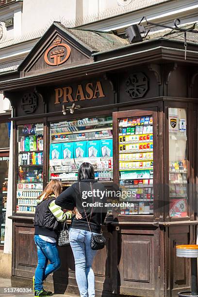 kiosk selling cigarettes on krakow street - buying cigarettes stock pictures, royalty-free photos & images