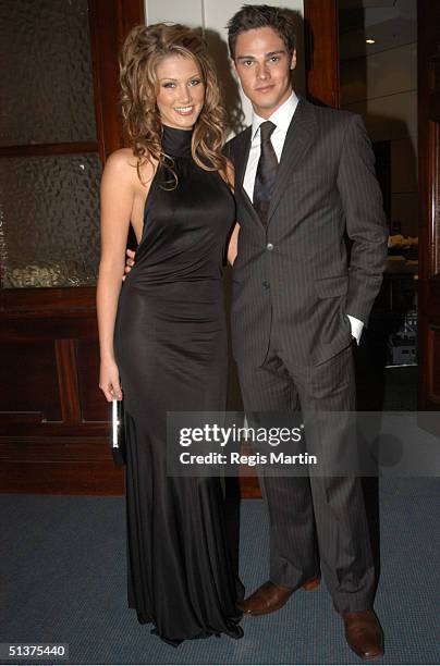 Delta Goodrem and Jay Bunyan at the Moet & Chandon Fashion Ball 2003 at the State Reference Library in Melbourne, Victoria, Australia. .