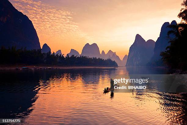 fishermen fishing in li river - guilin stock pictures, royalty-free photos & images