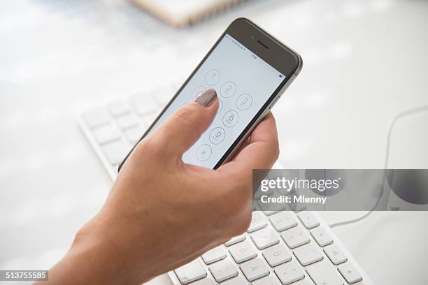 businesswoman dialing on apple iphone 6 - holding iphone stockfoto's en -beelden