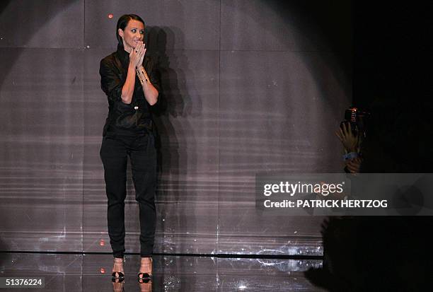 Italian fashion designer Alessandra Facchinetti acknowledges the applause at the end of Gucci's Spring/Summer 2005 women's collection at Milan...