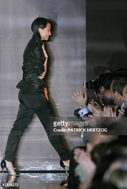 Italian fashion designer Alessandra Facchinetti acknowledges the applause at the end of Gucci's Spring/Summer 2005 women's collection at Milan...
