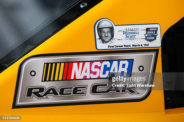 Sticker for Wendell Scott is seen on the car of Kyle Busch, driver of the M&M's 75 Toyota, during practice for the NASCAR Sprint Cup Series Kobalt...