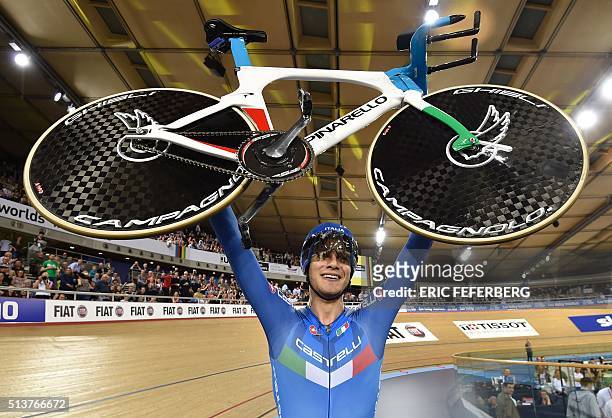 Italy's Filippo Ganna celebrates taking gold in the Men's Individual pursuit final during the 2016 Track Cycling World Championships at the Lee...