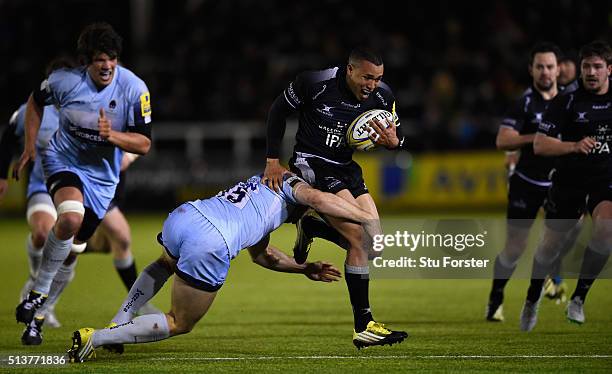 Falcons wing Marcus Watson is tackled by Warriors full back Chris Pennell during the Aviva Premiership match between Newcastle Falcons and Worcester...