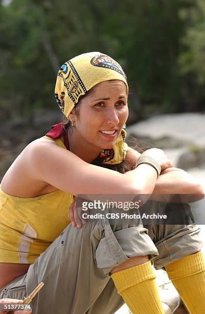 American reality show participant and ersatz castaway Julie Berry wears yellow socks as she sits on the beach during the second episode of 'SURVIVOR:...