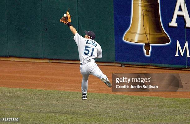 Ichiro Suzuki of the Seattle Mariners makes a backhanded catch for an out against the Oakland Athletics September 30, 2004 at the Network Associates...