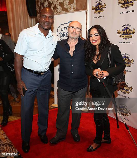 Evander Holyfield, Phil Collins, and Orianne Cevey attend Press Conference for the Little Dreams Foundation at Seminole Hard Rock Hotel & Casino -...