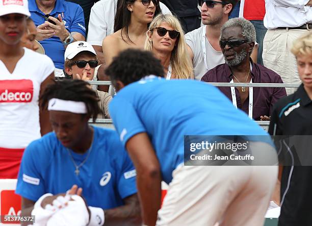 Isabelle Camus, wife of Yannick Noah, their son Joalukas Noah and Yannick's father Zacharie Noah look on while captain of France Yannick Noah talks...