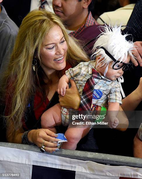 Susan Lomas of Nevada holds her 3-month-old son Oliver Lomas, dressed as Democratic presidential candidate Sen. Bernie Sanders during his campaign...