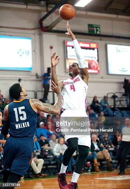 Maine Red Claws vs Iowa Energy. Coty Clarke of Maine shoots over Ty Walker of Iowa in the second quarter.