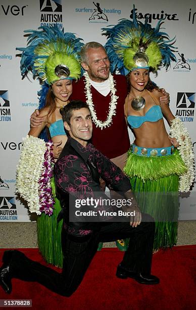 Musicians Perry Farrell and Flea pose with "island girls" at the Esquire House Los Angeles' Endless Summer Party benefitting the Autism Coalition and...