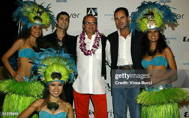 Musician Perry Farrell and Esquire editor Stephen Jacoby and publisher Kevin O'Malley pose with "island girls" at the Esquire House Los Angeles'...