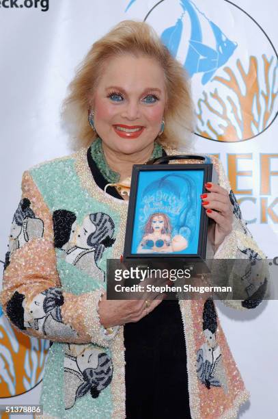 Actress Carol Connors shows her purse at the 2nd Annual Rescue Benefit at The Victorian on September 30, 2004 in Santa Monica, California.