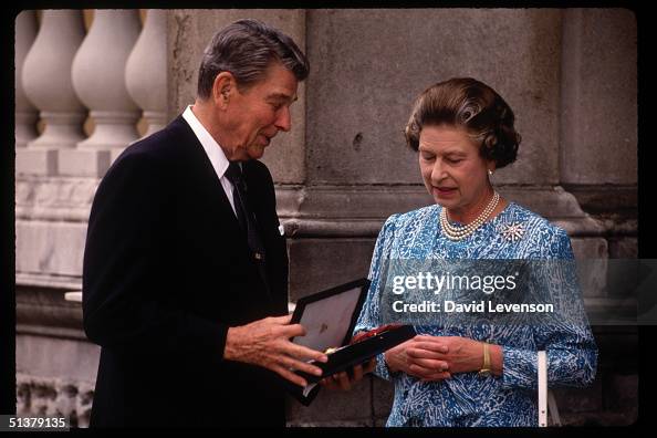 Queen Elizabeth II presents US President Ronald Reagan with an honoury Knighthood Queen Elizabeth II presents US President Ronald Reagan with an honoury Knighthood