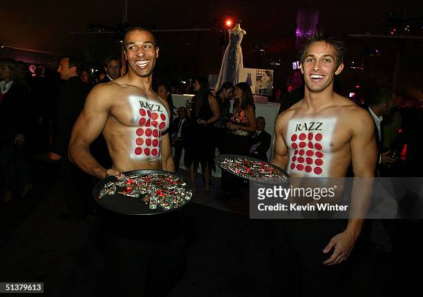 The Razz Bacardi promotional models pose inside the Macy's Passport Gala to Benefit HIV/AIDS Research and Awareness on September 30, 2004 in Santa...