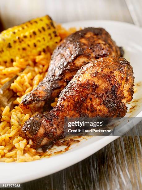 jerk chicken with rice and corn - burnt chicken stock pictures, royalty-free photos & images