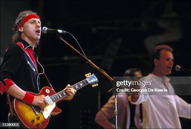 Mark Knopfler of Dire Straits sings during Live Aid in Wembley stadium 13 July 2004.