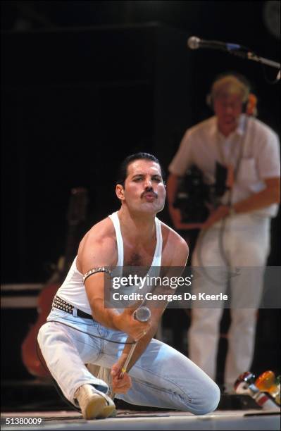 Singer Freddie Mercury of Queen performs during Live Aid at Wembley Stadium on 13 July 1985.