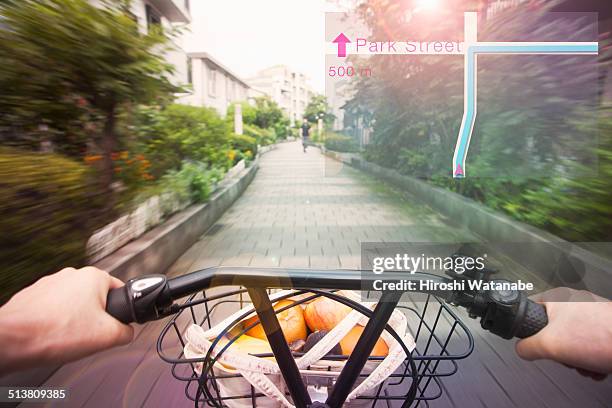 cycling with navigator seen through smart glasses. - bicycle basket stock pictures, royalty-free photos & images