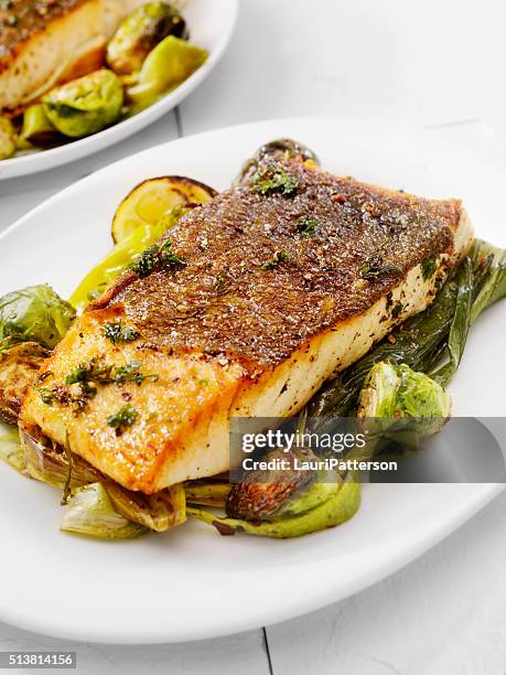 crispy skin grilled white fish - cod stockfoto's en -beelden